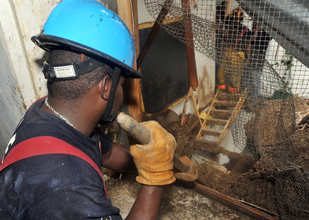 Haitian firefighters look for survivors