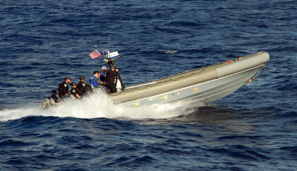 Sailors and Coast Guardsmen from the littoral combat ship USS Freedom