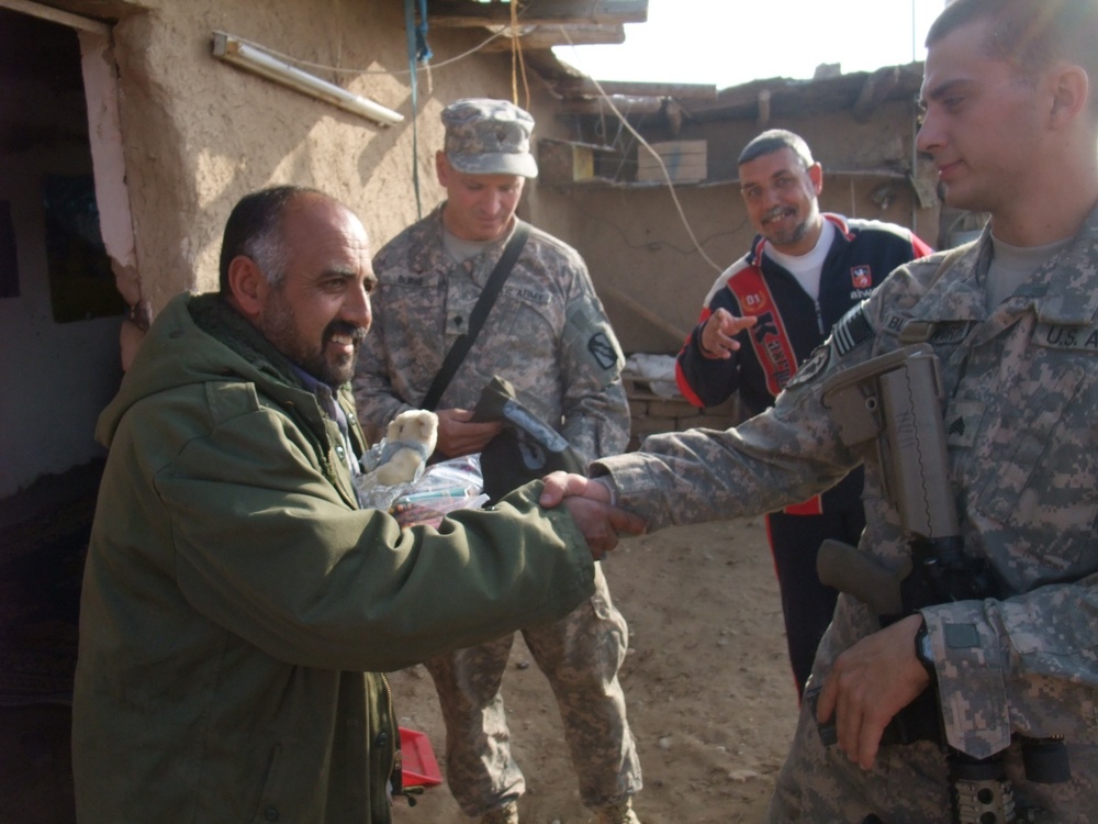 Mississippi Guardsman visit friend, bring gifts