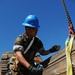 Sailors move supplies