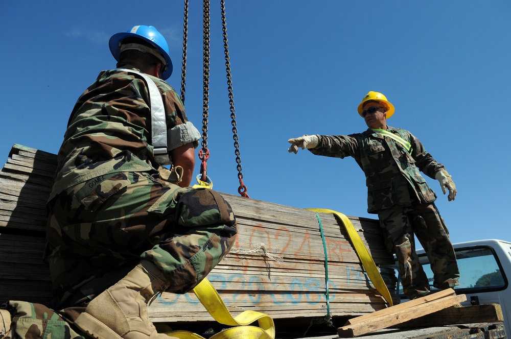 Sailors move supplies