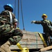 Sailors move supplies