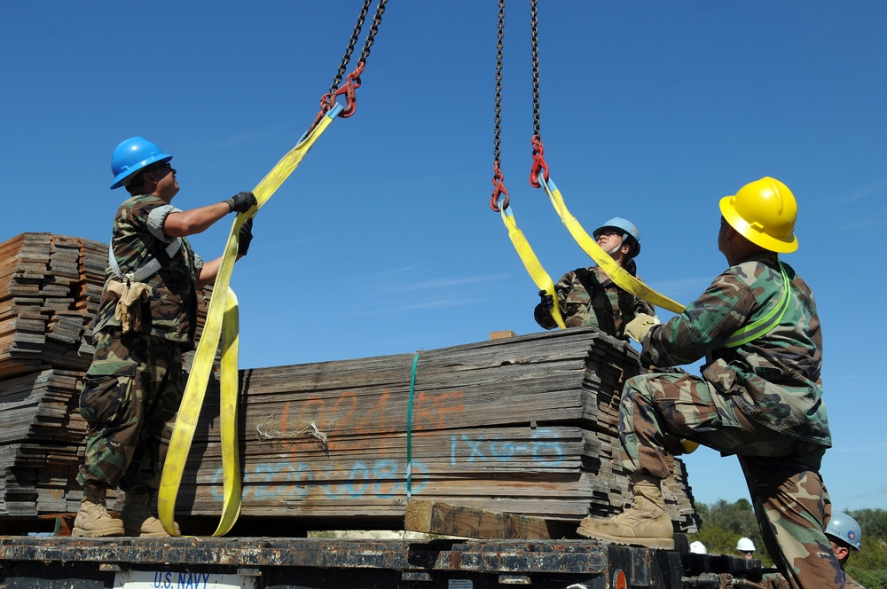 Sailors move supplies