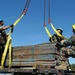 Sailors move supplies