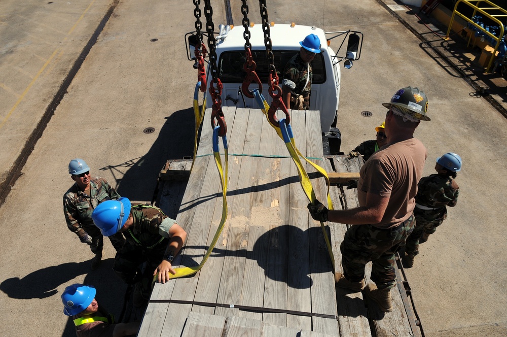 Sailors move supplies