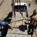 Sailors move supplies