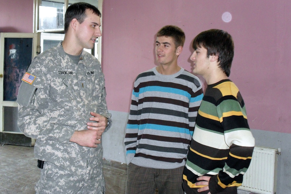 U.S. Kosovo Forces aviators take students high in language-learning