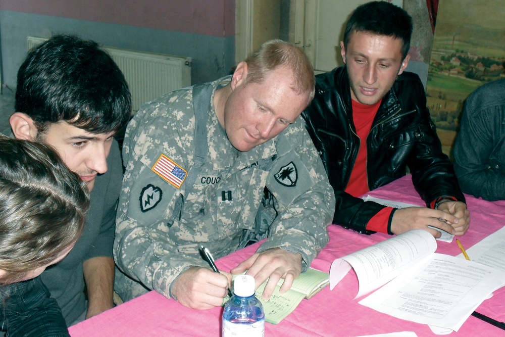 U.S. Kosovo Forces aviators take students high in language-learning