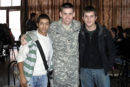 U.S. Kosovo Forces aviators take students high in language-learning