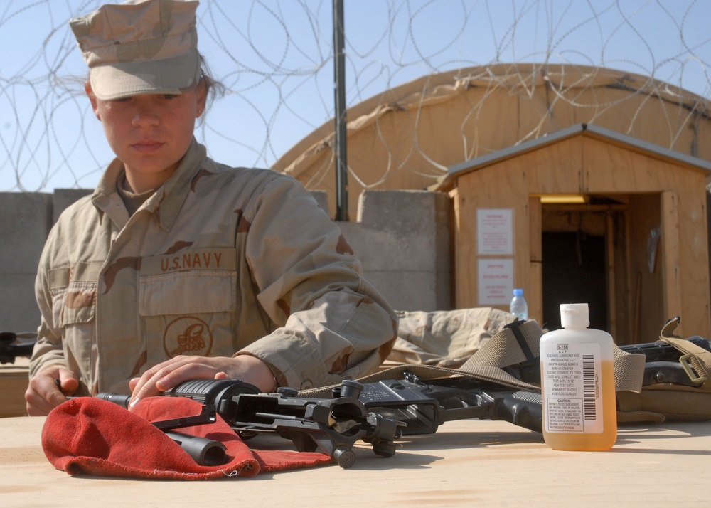 Seabee Performs Weapons Maintenance at Kamp Krutke
