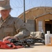 Seabee Performs Weapons Maintenance at Kamp Krutke