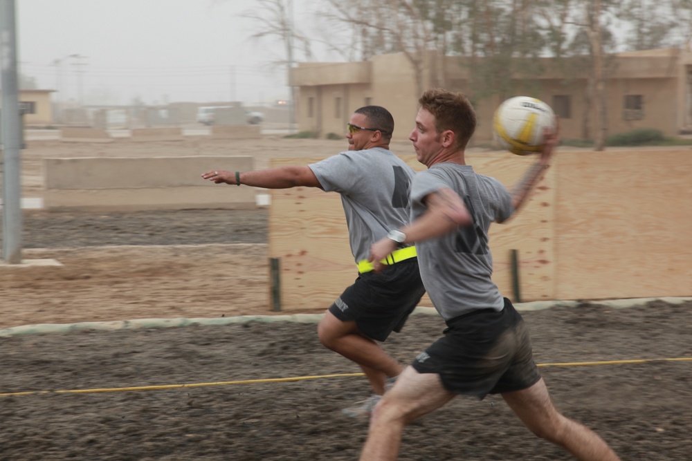 U.S. Soldiers from 2-23 Infantry Regiment play a volleyball game on Camp Taji