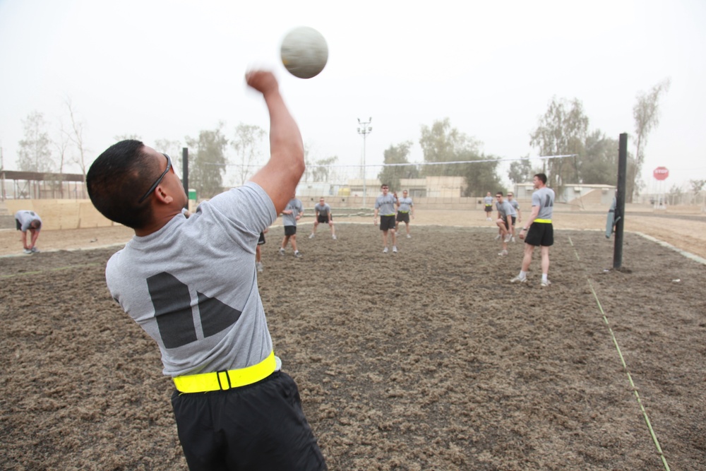 U.S. Soldiers from 2-23 Infantry Regiment play a volleyball game on Camp Taji