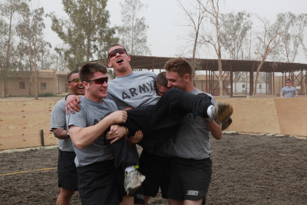 U.S. Soldiers from 2-23 Infantry Regiment play a volleyball game on Camp Taji