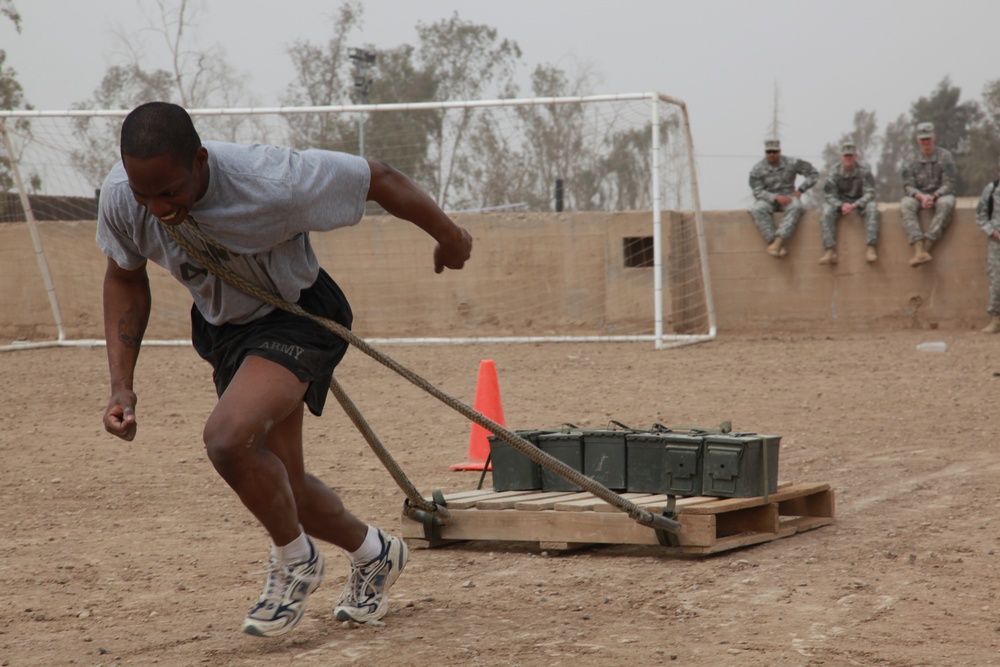 U.S. Soldiers from 2-23 Infantry Regiment play a volleyball game on Camp Taji