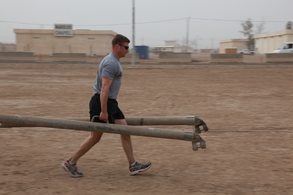 U.S. Soldiers from 2-23 Infantry Regiment play a volleyball game on Camp Taji