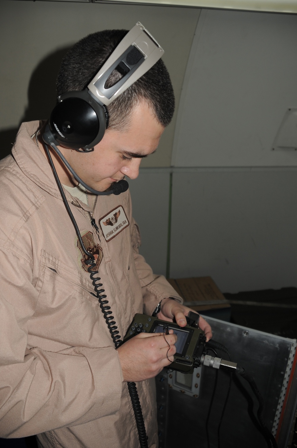 Tinker Senior Airman Performs a Systems Check on a Deployed Air Mission