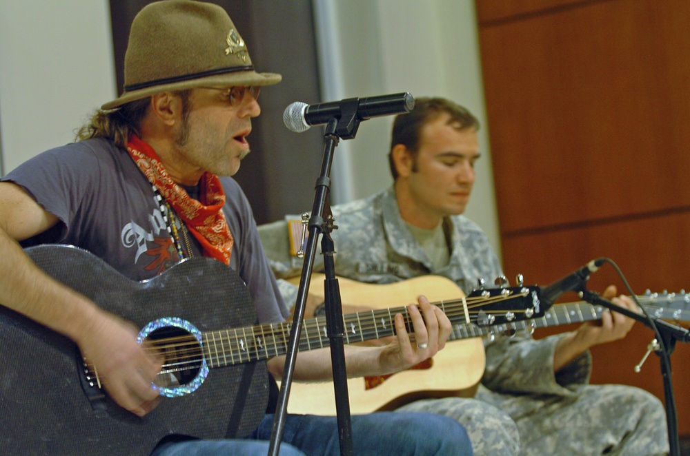 Country musician Big Kenny performs for troops in Haiti