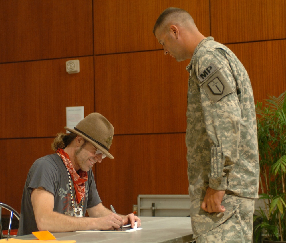 Country musician Big Kenny performs for troops in Haiti