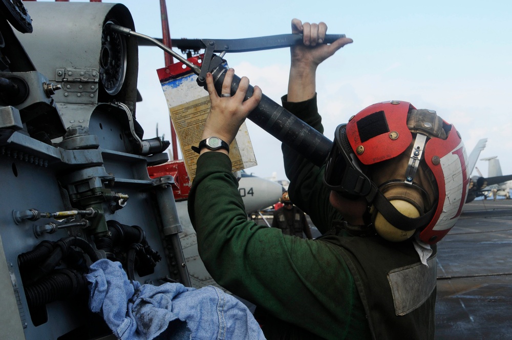maintenance on an SH-60F Sea Hawk