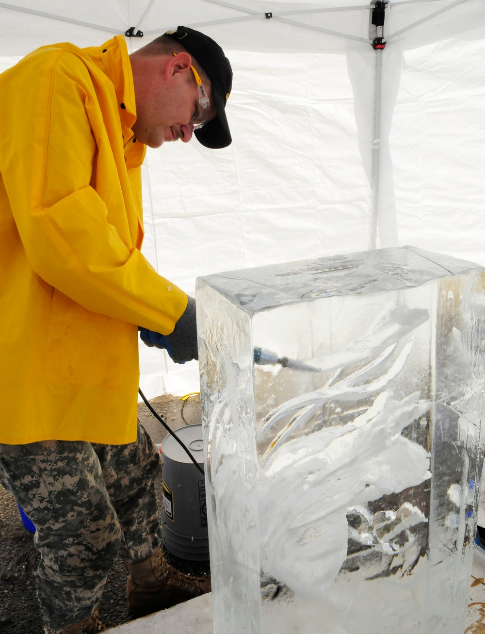 Sgt. Skinner competes in single block ice carving at the Army Culinary Arts Competition