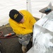 Sgt. Skinner competes in single block ice carving at the Army Culinary Arts Competition