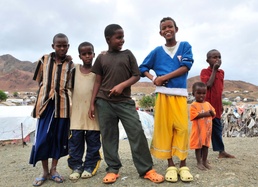 Camp Personnel Help Distribute Shoes to Refugees in Djibouti