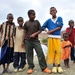 Camp Personnel Help Distribute Shoes to Refugees in Djibouti