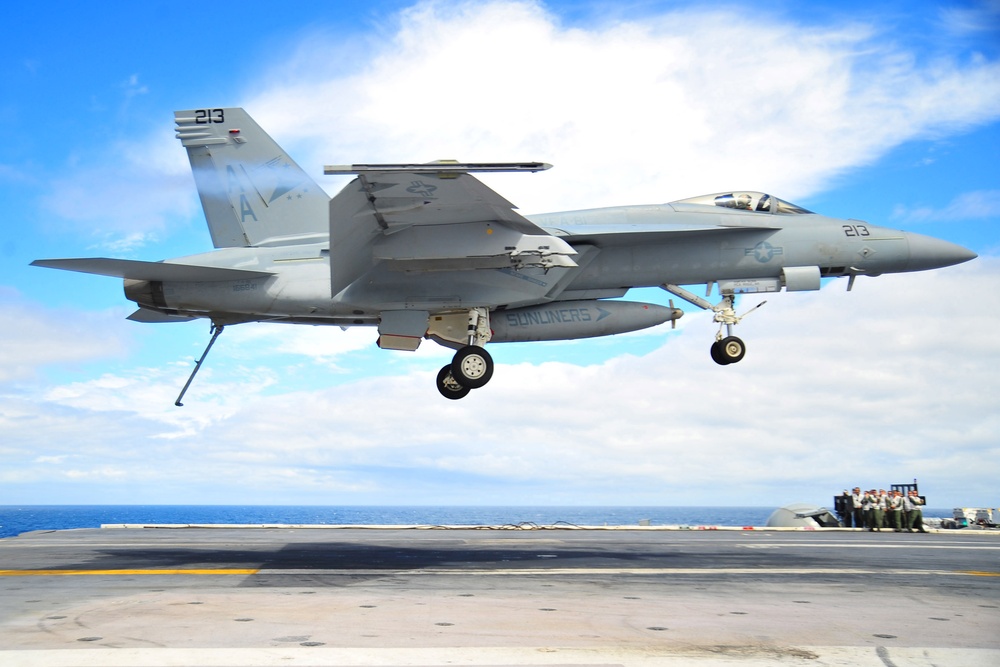 high-speed maneuvers over USS Carl Vinson