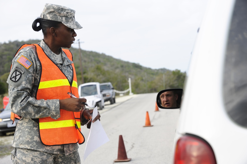 Soldiers inspect vehicles