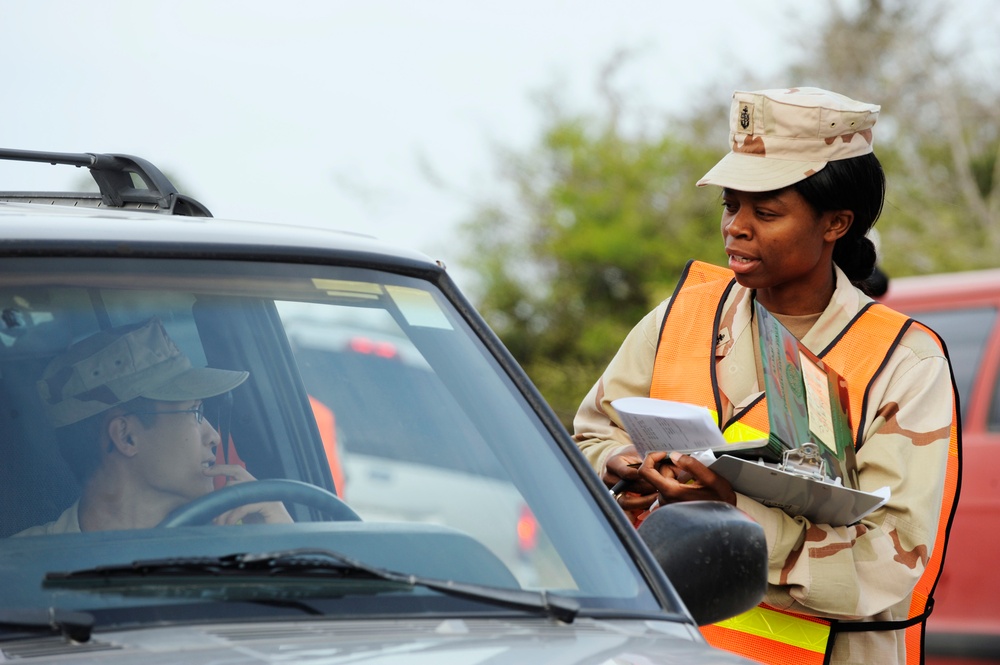 Soldiers inspect vehicles