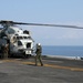 Flight-line mechanics with HMH 461 (Reinforced), 22nd MEU, conduct maintenance on a CH-53E