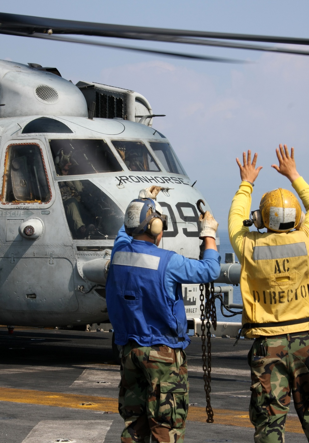 Flight-line mechanics with HMH 461 (Reinforced), 22nd MEU, conduct maintenance on a CH-53E