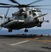 Flight-line mechanics with HMH 461 (Reinforced), 22nd MEU, conduct maintenance on a CH-53E