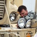 U.S. military convoy escorts install donated off-road lights