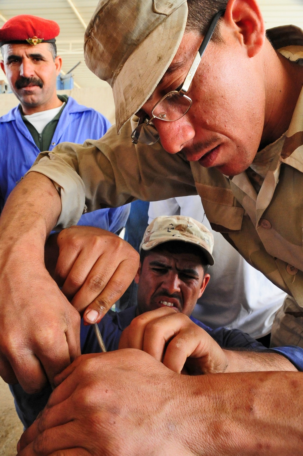 Iraqi army technicians work on transmissions