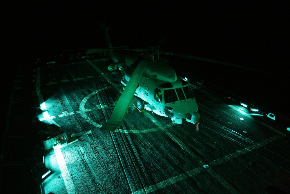 pre-dawn launch on the flight deck of USS McClusky