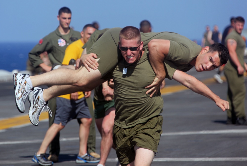 Marines and sailors from the 22nd MEU, and sailors from USS Bataan, participate in a 5-kilometer run