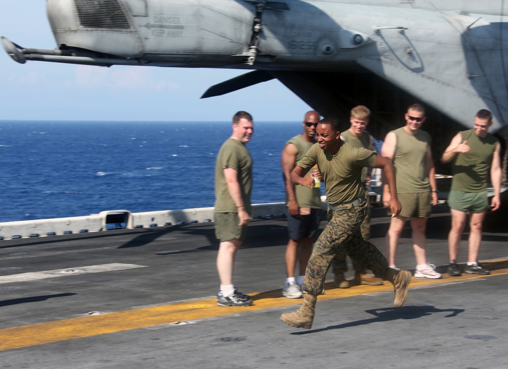 Marines and sailors from the 22nd MEU, and sailors from USS Bataan, participate in a 5-kilometer run