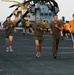 Marines from the 22nd MEU compete in a race aboard USS Bataan, during a Fun-in-the-Sun day