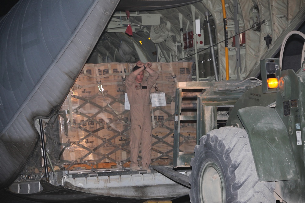 Marines load supplies onto C-130