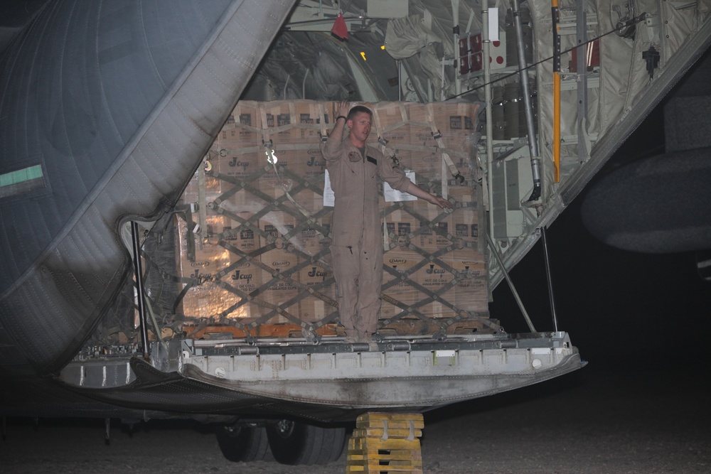 Marines load supplies onto C-130