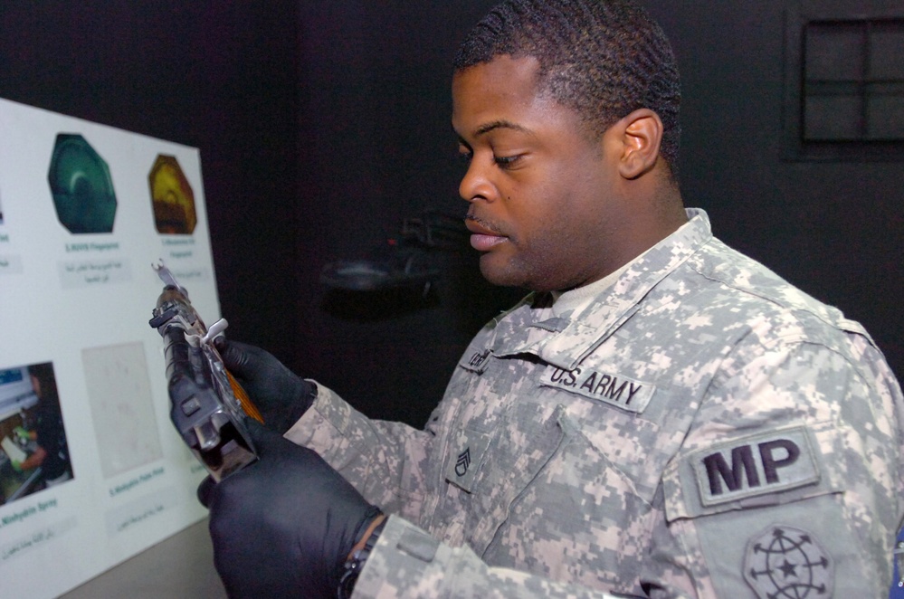 A soldier from Millen helps the Iraqis learn forensics