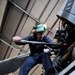 Sailors maintain helicopters