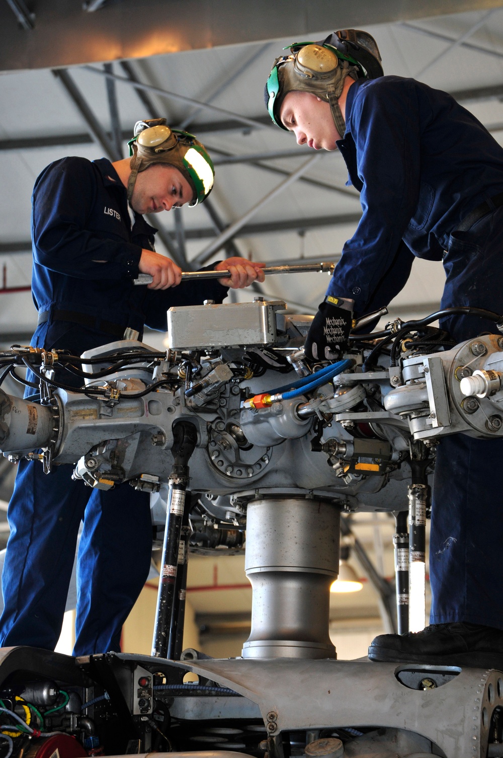 Sailors maintain helicopters