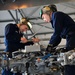 Sailors maintain helicopters