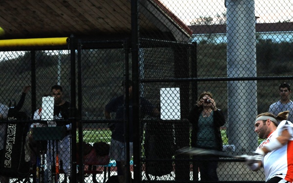 Service members play baseball