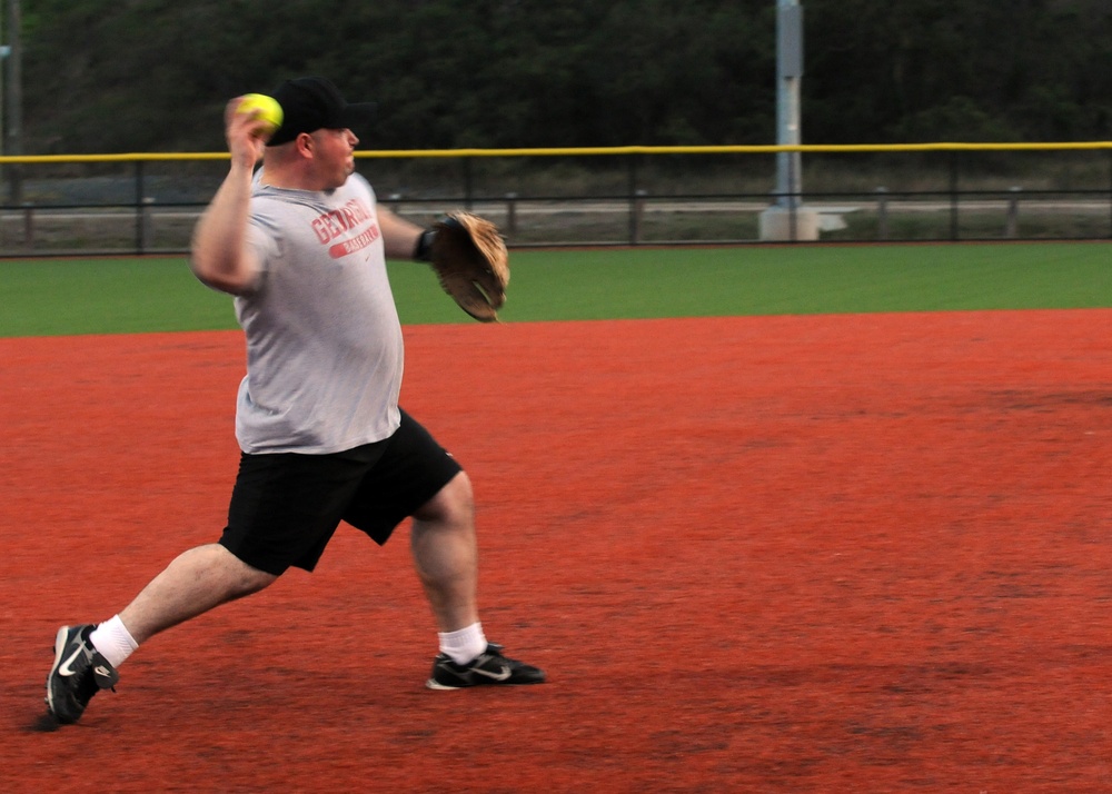 Service members play baseball