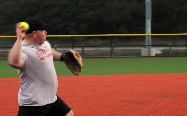 Service members play baseball