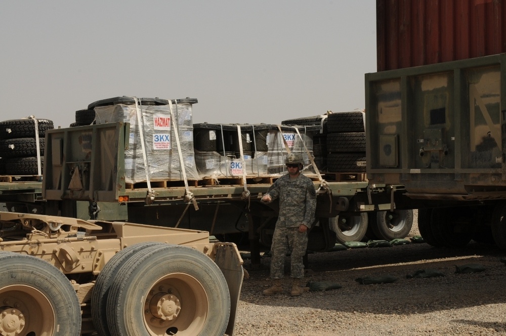 Soldiers track trailers at transfer point